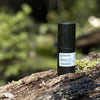 Product shot of ReBoost – Hyaluronic Acid Booster on a log in nature